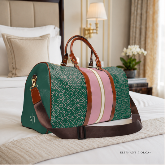 Personalized pink and green women's travel duffel bag with brown handles and two-letter initials on side panel.