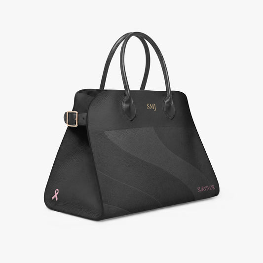 Black vegan leather breast cancer survivor handbag personalized with gold monogram, pink survivor text and breast cancer awareness ribbon.