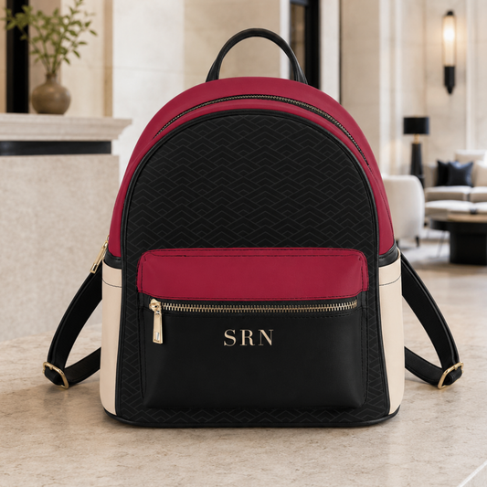 Crimson, cream and black vegan leather mini backpack with gold hardware and personalized three-letter monogram.